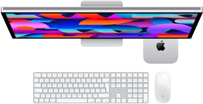 Mac mini colocada debajo de un monitor Studio Display, Magic Keyboard con teclado numérico, Magic Mouse